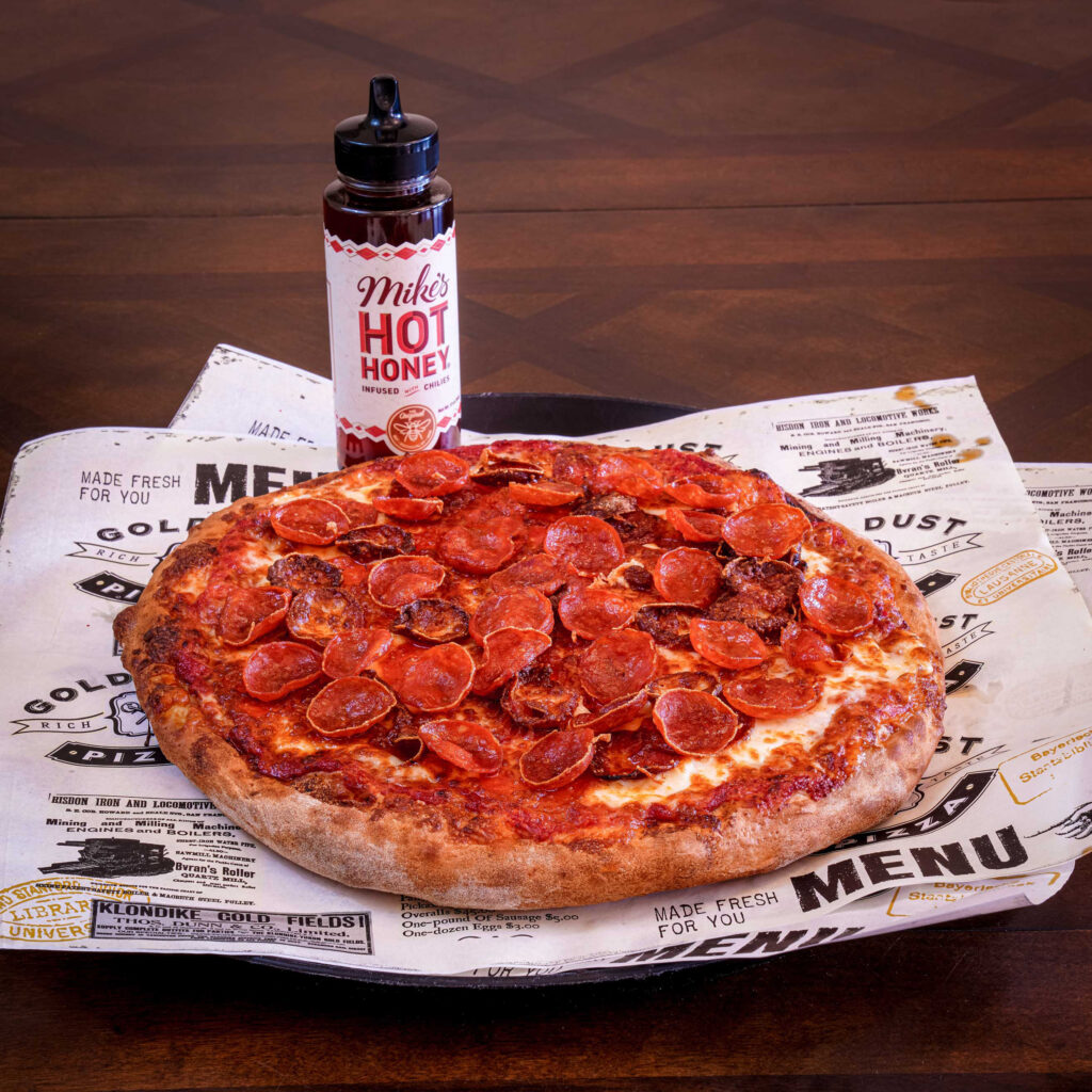 The Secret's Out: Why Everyone's Ordering the Triple Strike Pizza